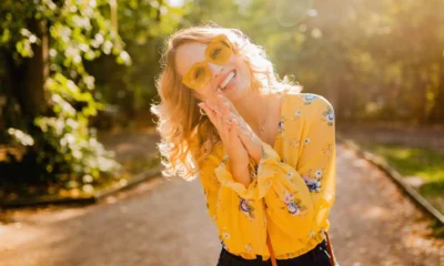 portrait-beautiful-blond-stylish-smiling-woman-yellow-blouse-wearing-sunglasses_285396-8325-1920×1280.jpg