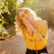 portrait-beautiful-blond-stylish-smiling-woman-yellow-blouse-wearing-sunglasses_285396-8325-1920×1280.jpg