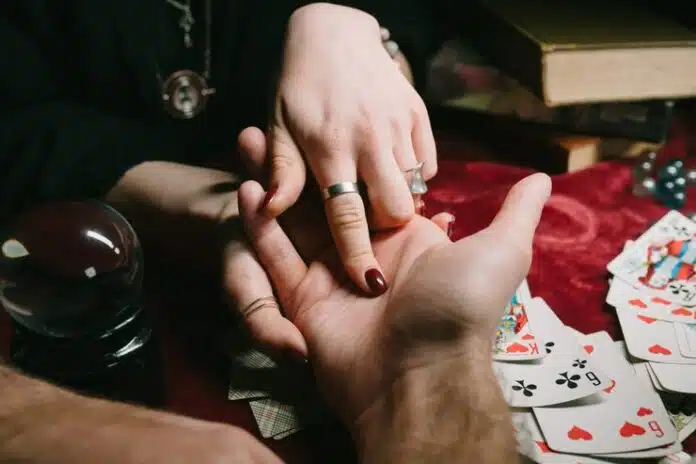 reading-lines-hand-man-s-hands-close-view_1153-5483-696×464.jpg