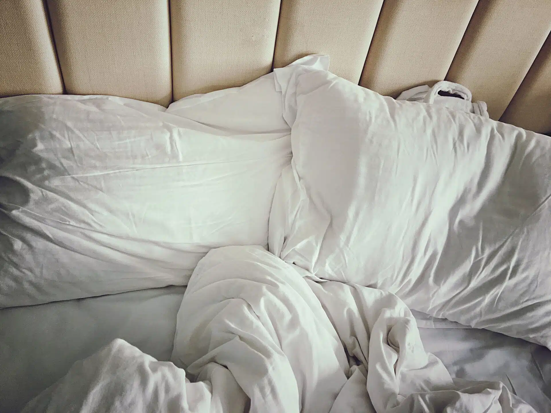 messy-bed-with-white-sheets-royalty-free-image-636746579-1548883332-1-1920×1440.jpg