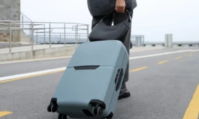side-view-traveler-with-suitcase-scaled-1-1920×1277.jpg-900×473