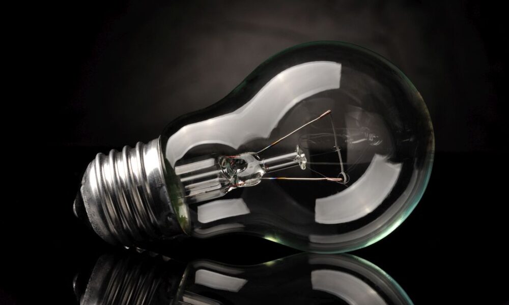 Light bulb on black background
