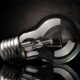 Light bulb on black background