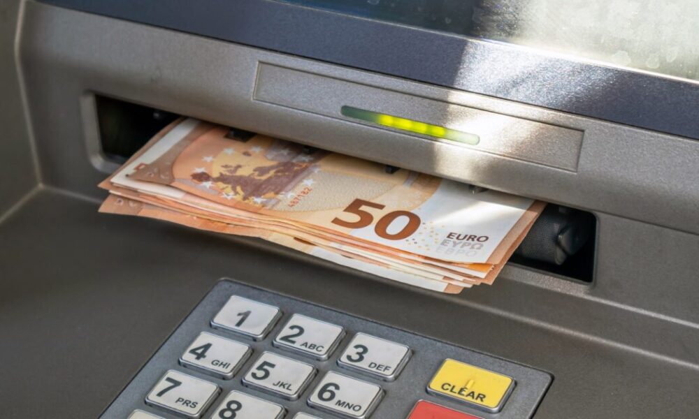 Atm,And,Cash,Money.,Euros,Withdrawal,From,An,Atm,Machine,