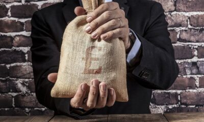 Man,Holding,A,Big,Sack,Of,Money
